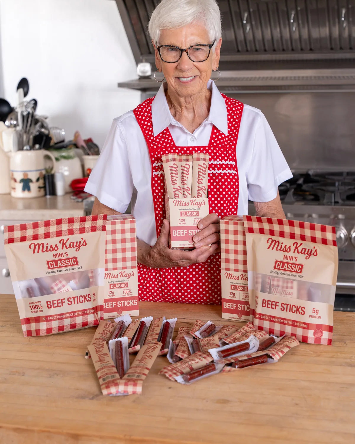 A mom and child sharing Miss Kay's grass-fed beef sticks