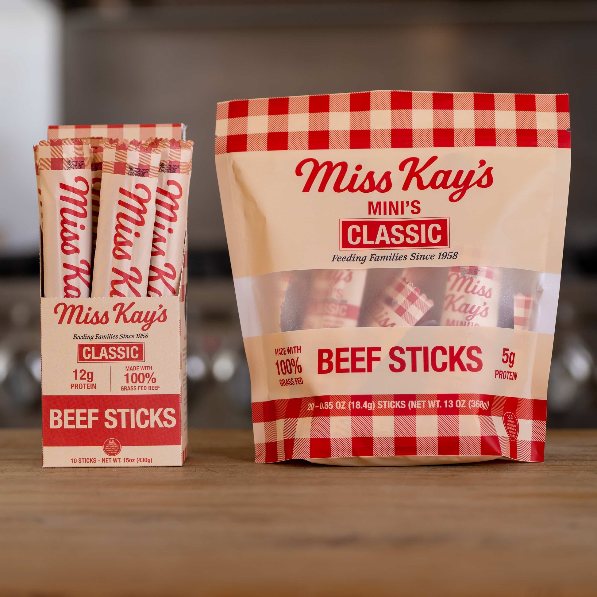 Miss Kay's Classic Mini bag beside the full-size Classic box, showing how much smaller the minis are