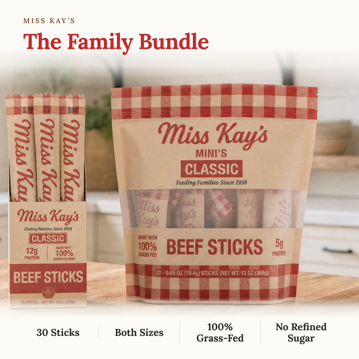 Miss Kay's Beef Sticks family bundle featuring a large bag of Mini's Classic Beef Sticks and three individual stick packs displayed on a wooden surface with a blurred kitchen background. Text overlays highlight the bundle contents: 30 Sticks, Both Sizes, 100% Grass-Fed, No Refined Sugar.