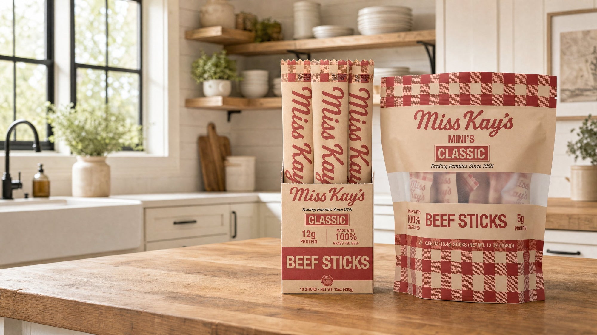 A Miss Kay's Classic beef sticks box and a Classic Mini bag on a wooden kitchen counter